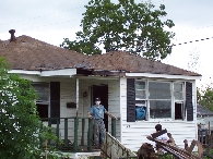 House with debris pile